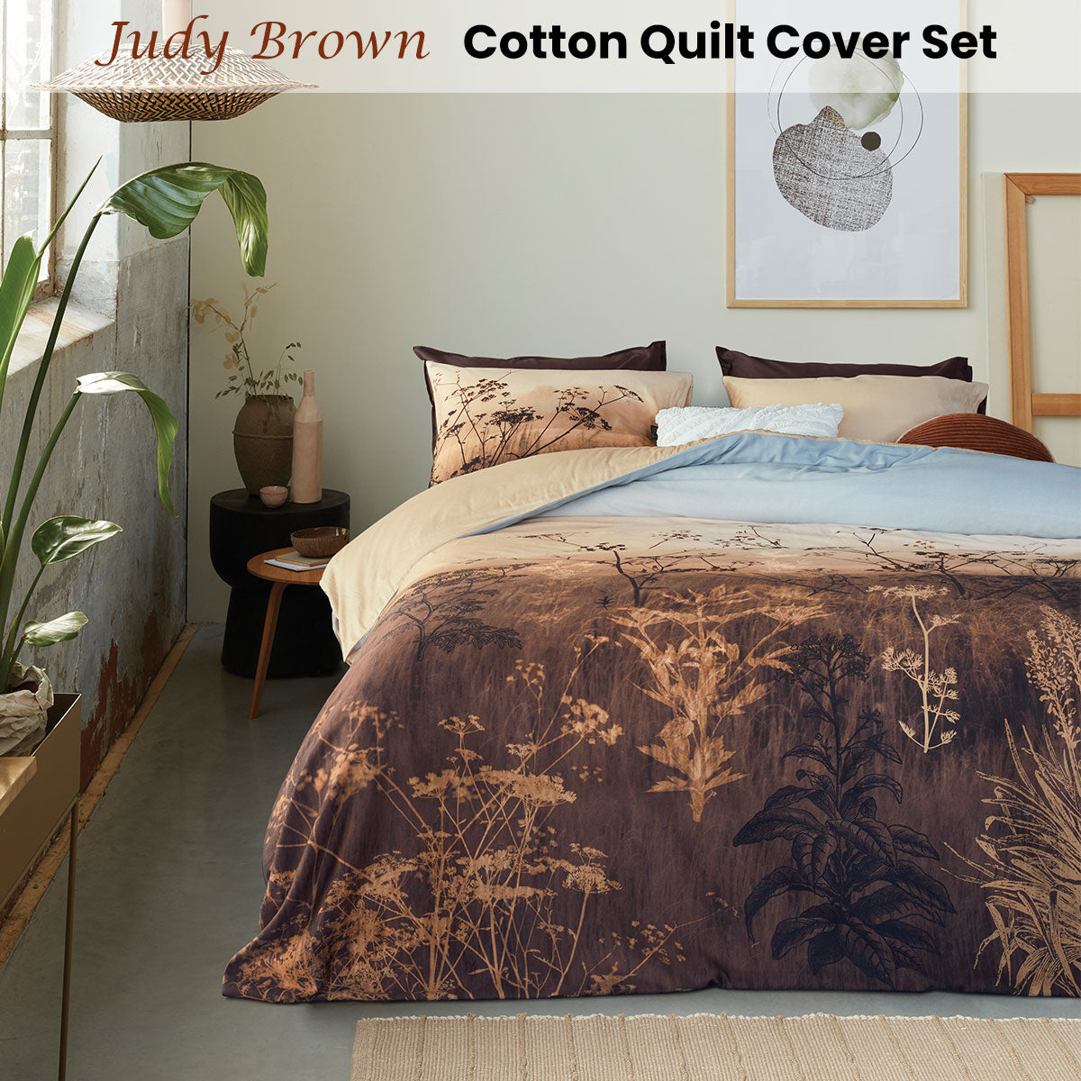 Bedding House Judy Brown Cotton Quilt Cover Set featuring a wildflower landscape print in taupe, brown, and sky colors, with a solid sand back.