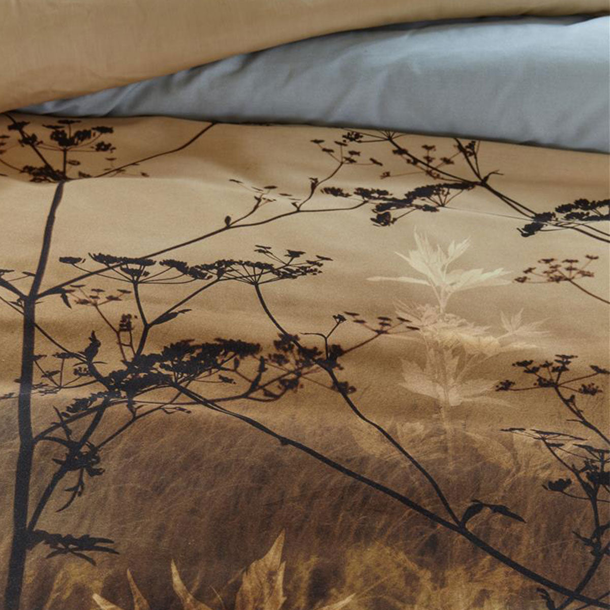 Bedding House Judy Brown Cotton Quilt Cover Set featuring a wildflower landscape print in taupe, brown, and sky colors, with a solid sand back.