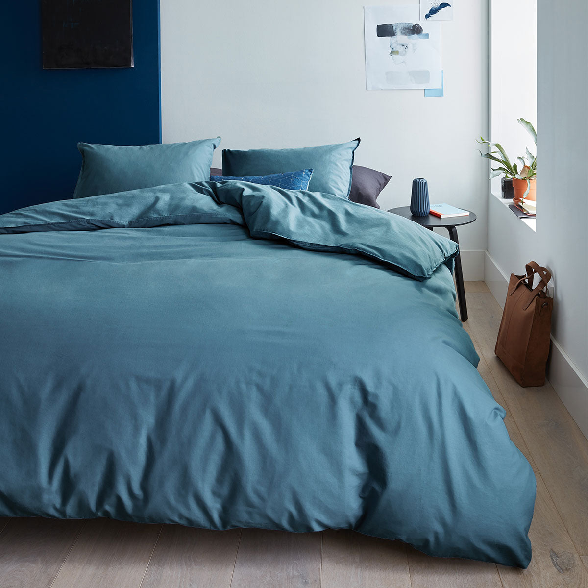 Bedding House Organic Cotton Basic Blue Grey Quilt Cover Set King displayed on a bed, showcasing its soft texture and elegant color.