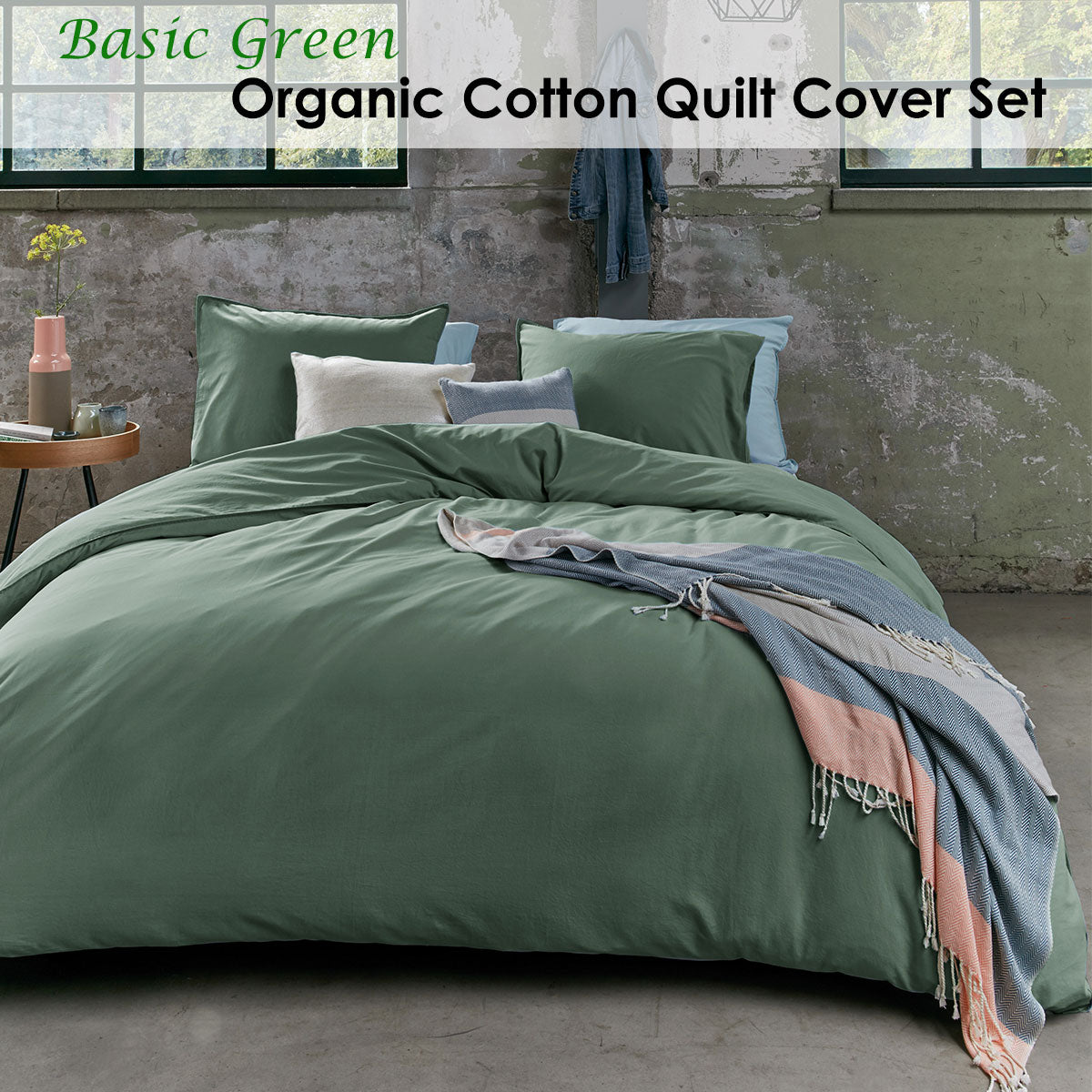 Bedding House Organic Cotton Basic Green Quilt Cover Set displayed on a bed, featuring a solid green color and soft texture.