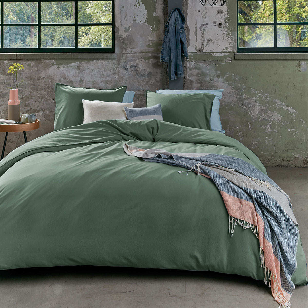 Bedding House Organic Cotton Basic Green Quilt Cover Set displayed on a bed, featuring a solid green color and soft texture.