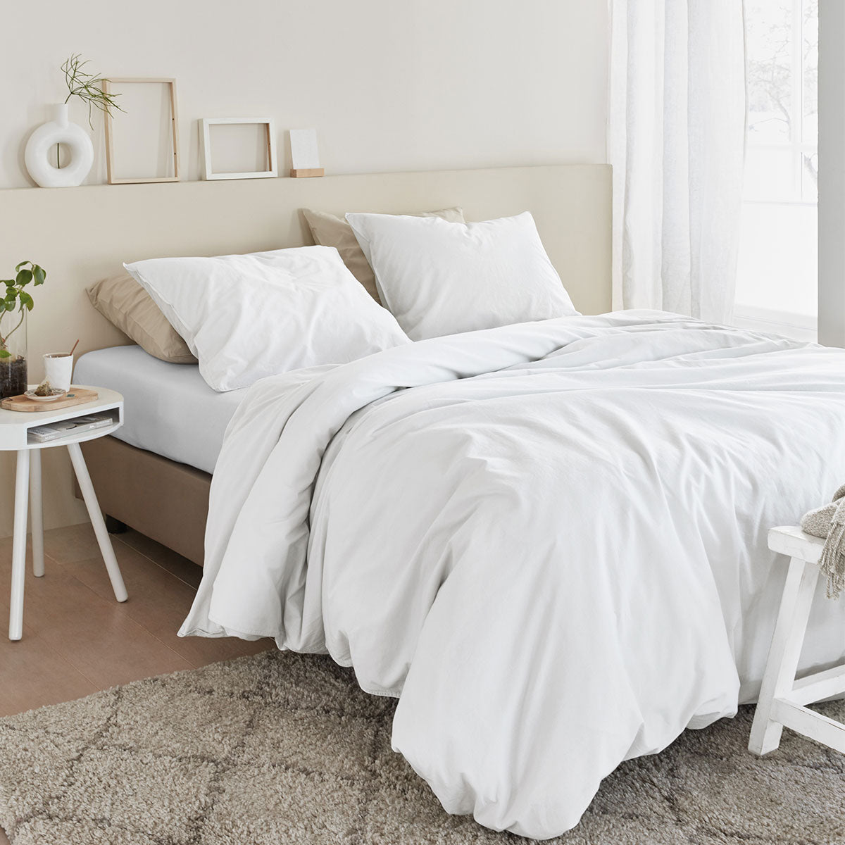 Bedding House Organic Cotton Basic White Quilt Cover Set King displayed on a bed, showcasing its soft texture and elegant design.