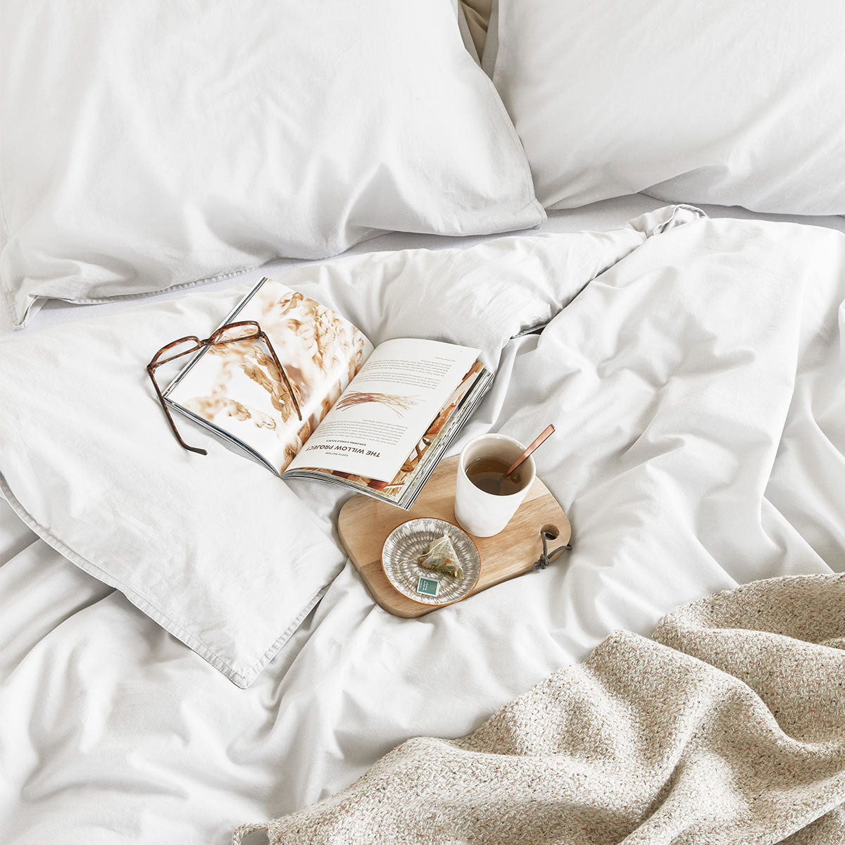 Bedding House Organic Cotton Basic White Quilt Cover Set displayed on a super king bed, showcasing its soft texture and elegant design.