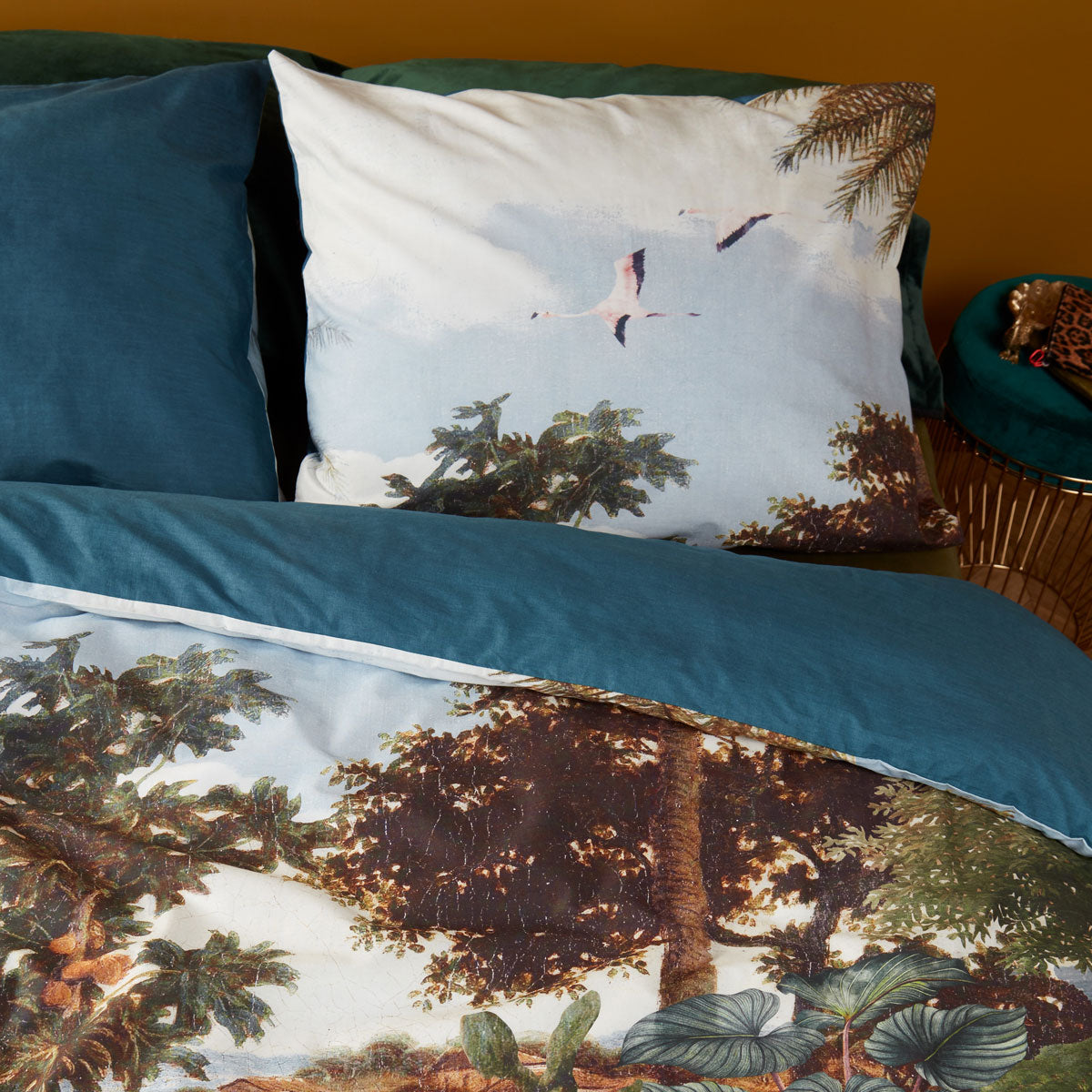 Bedding House Voyage Green Cotton Quilt Cover Set featuring a vibrant botanical landscape with animals and a serene river.