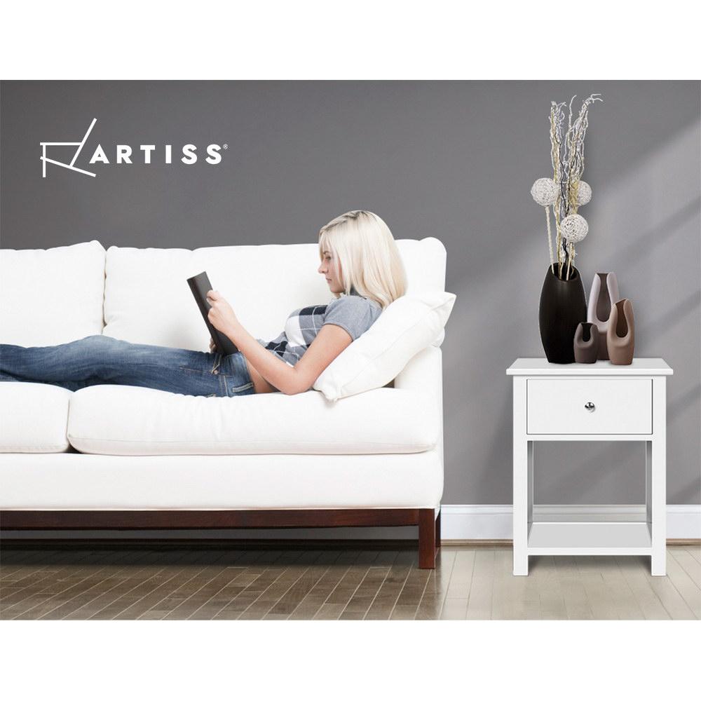 Rustic white wooden bedside table with drawer and shelf, showcasing elegant design and sturdy construction.