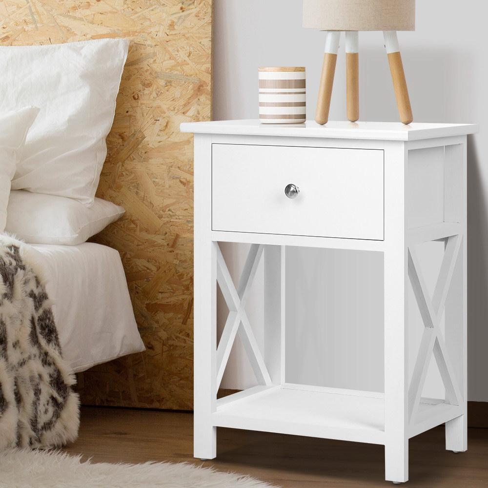 Rustic white wooden bedside table with drawer and shelf, showcasing elegant design and sturdy construction.