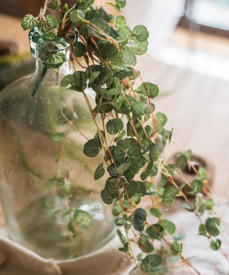 A 27-inch long Begonia Leaf Hanging Vine featuring realistic green leaves made from plastic and silk cloth, perfect for indoor and outdoor decor.