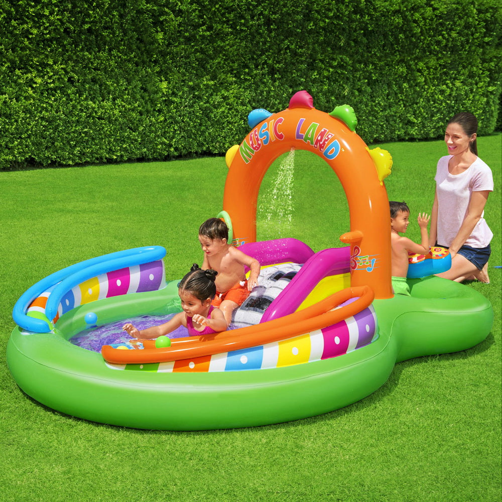 Bestway Inflatable Sing N Splash play pool featuring musical instruments, slide, and water sprayer for kids.