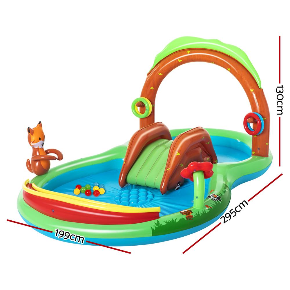 Bestway Swimming Pool Above Ground Inflatable for kids featuring a slide, water sprayer, and colorful play accessories in a backyard setting.