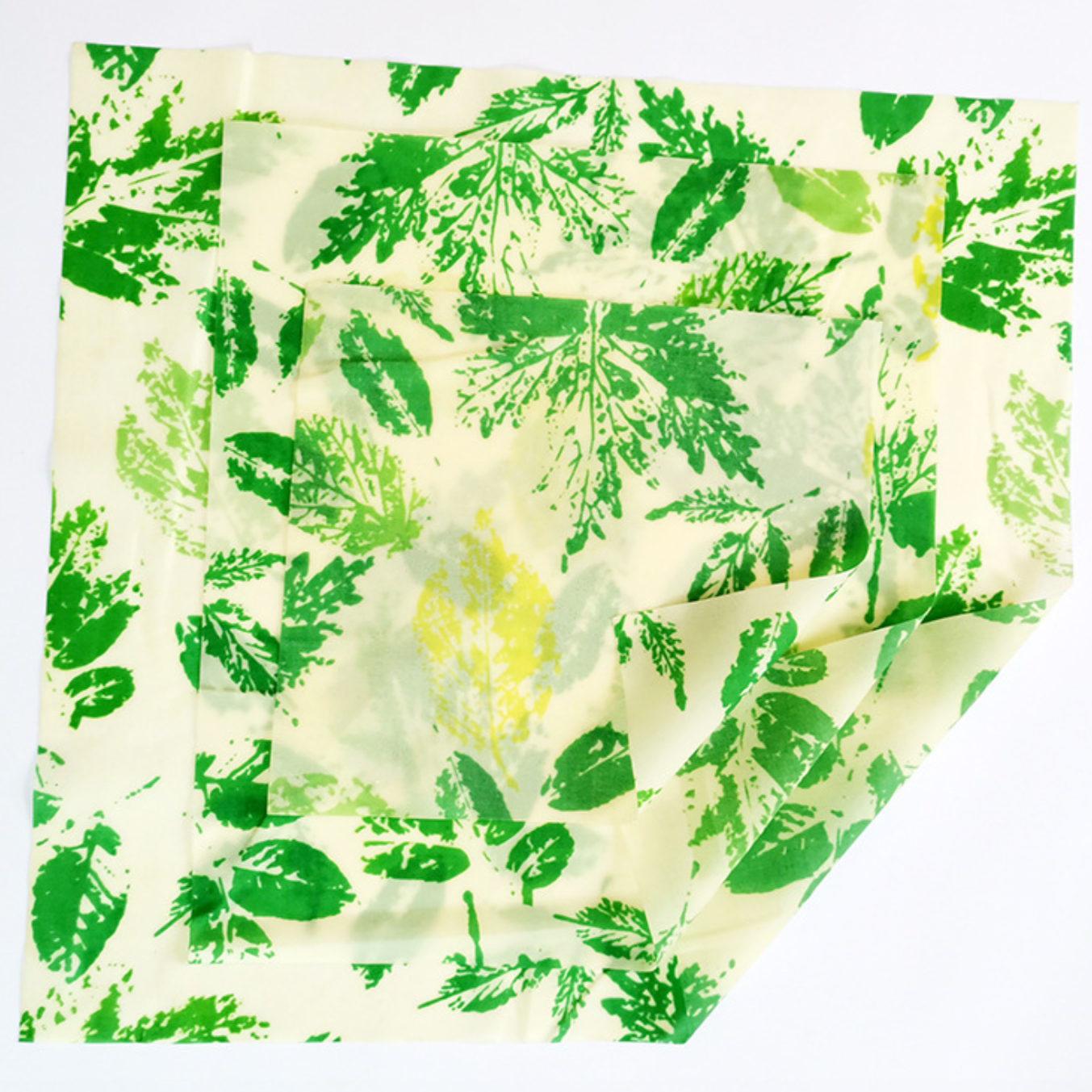 A set of three colorful Beeswax Food Wraps in various sizes, showcasing their eco-friendly design for food storage.