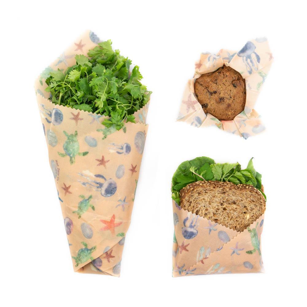 A set of three colorful Beeswax Food Wraps in various sizes, showcasing their eco-friendly design for food storage.