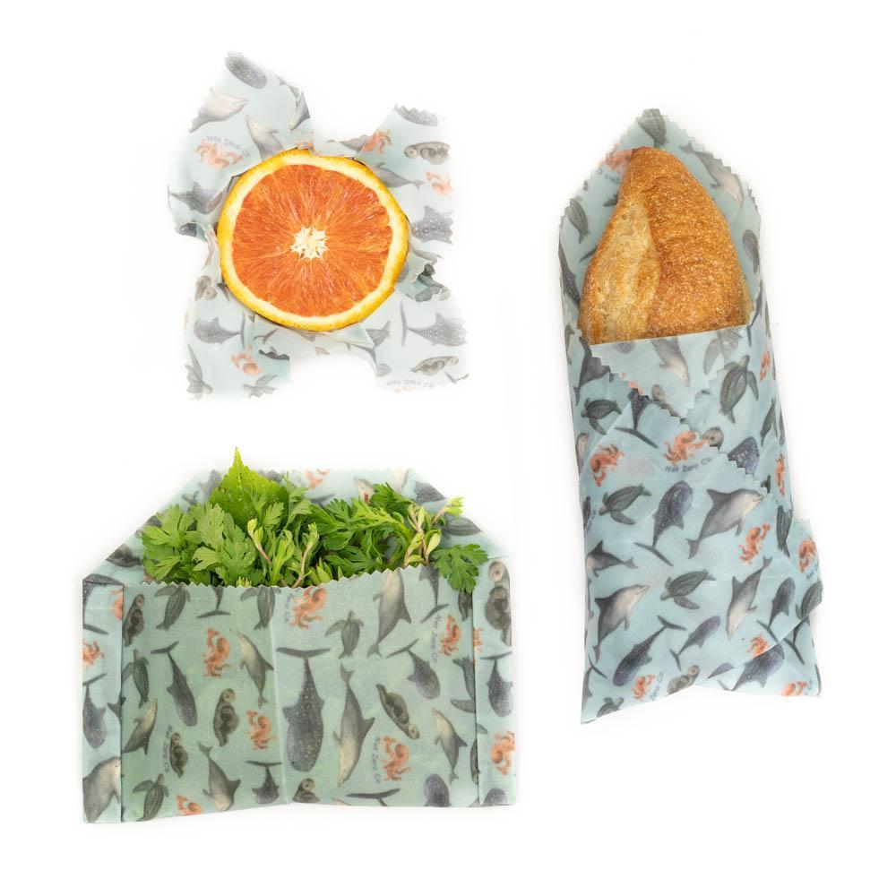 A set of three colorful Beeswax Food Wraps in various sizes, showcasing their eco-friendly design for food storage.