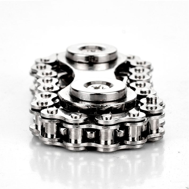 A stainless steel Bike Chain Gear Spinner designed for stress relief, featuring a unique bike chain design and silent bearings for smooth spinning.