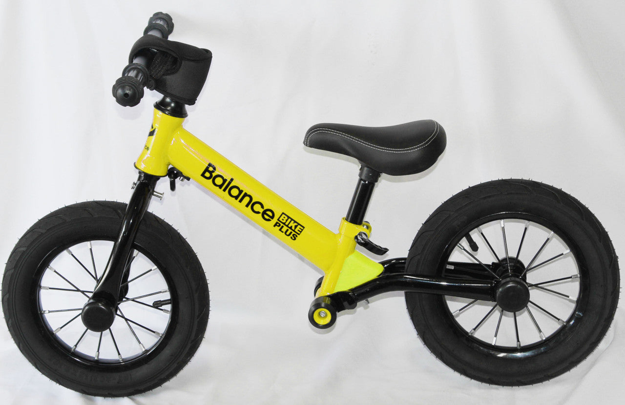 Bike Plus Kids Balance Bike in yellow, featuring a lightweight aluminum frame, 12-inch spoked wheels, and adjustable seat for children aged 2-6.