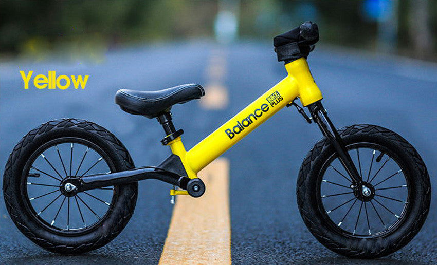 Bike Plus Kids Balance Bike in yellow, featuring a lightweight aluminum frame, 12-inch spoked wheels, and adjustable seat for children aged 2-6.