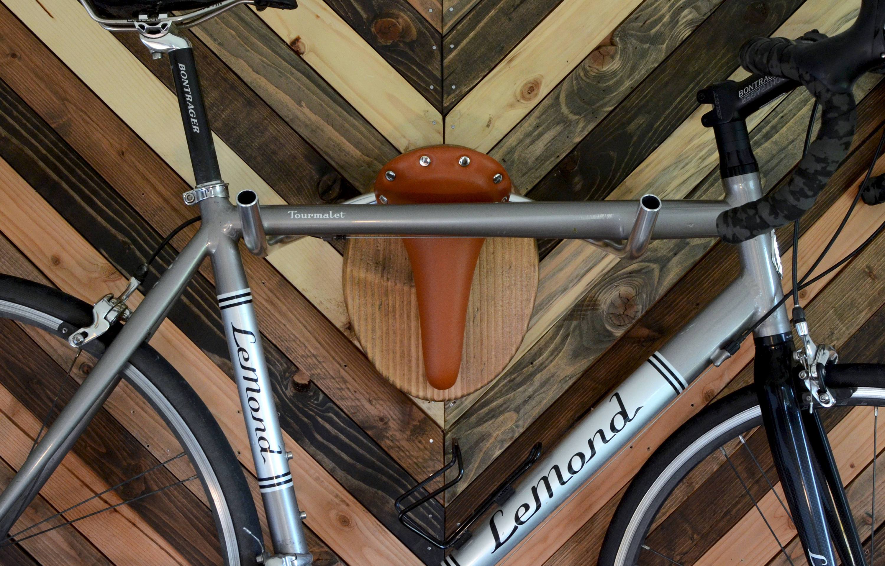 Hand-crafted Bicycle Taxidermy wall rack resembling a Texas longhorn, made from Evergreen Wood and leather.