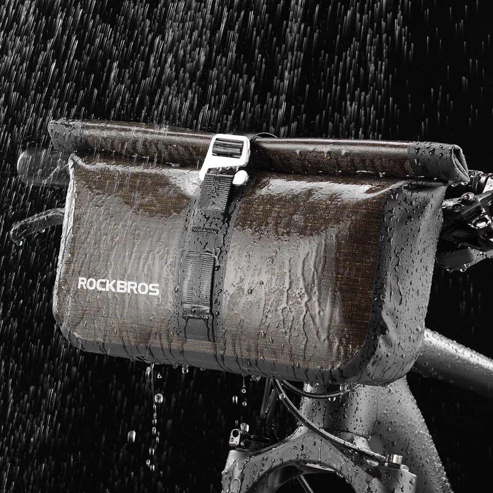 RockBros Bike Roll Bag, a waterproof handlebar pannier designed for cycling, featuring adjustable straps and a reflective logo for safety.