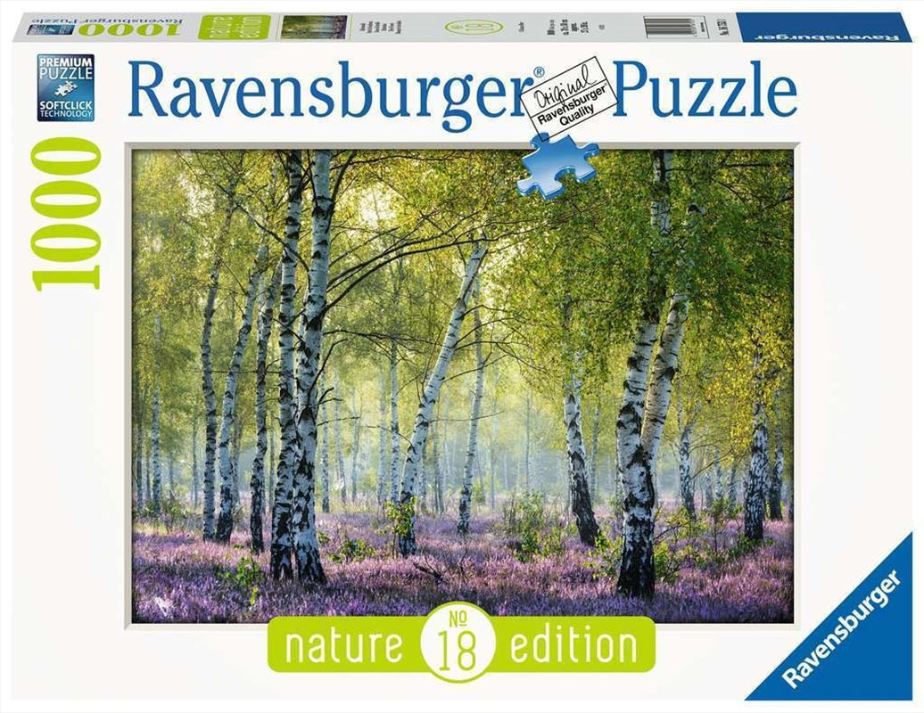 A 1000 piece Ravensburger puzzle featuring a serene birch forest scene, showcasing vibrant trees and a tranquil atmosphere.