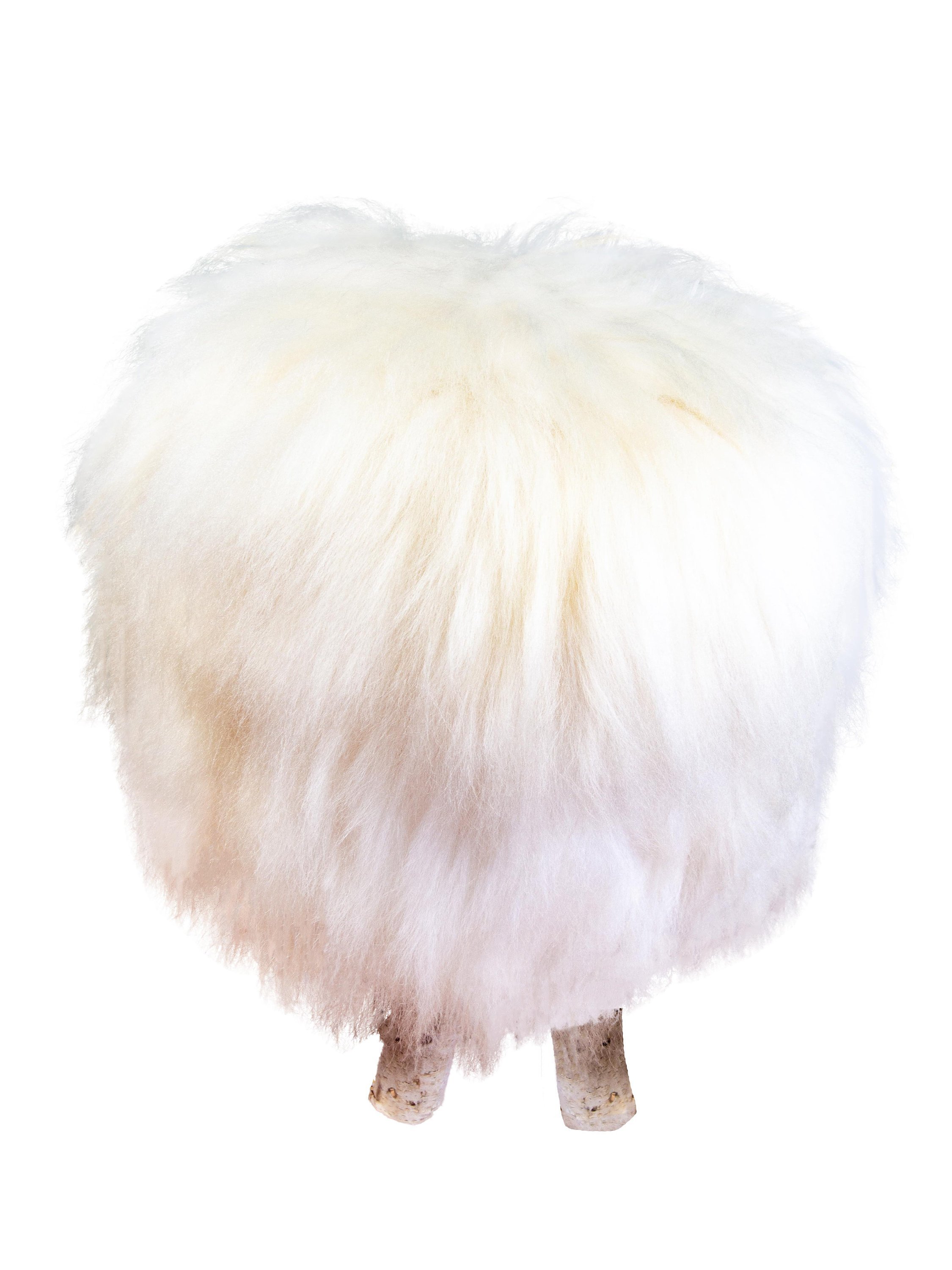 Birch Wood and Ivory Sheepskin Ottoman showcasing its fluffy texture and natural wood base, perfect for home decor.