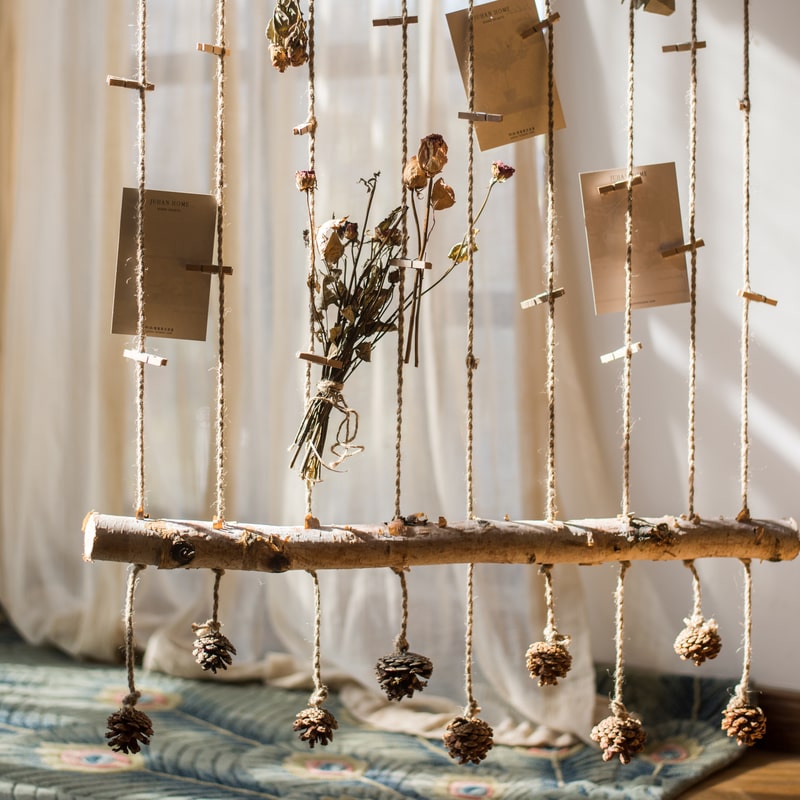 Birch Wood Photo Wall Hanger featuring natural wood, hemp rope, and pine cones, showcasing a rustic and stylish design.