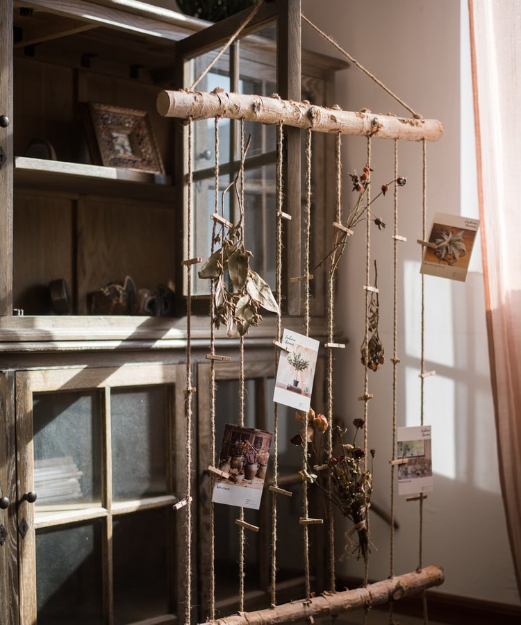 Birch Wood Photo Wall Hanger featuring natural wood, hemp rope, and pine cones, showcasing a rustic and stylish design.