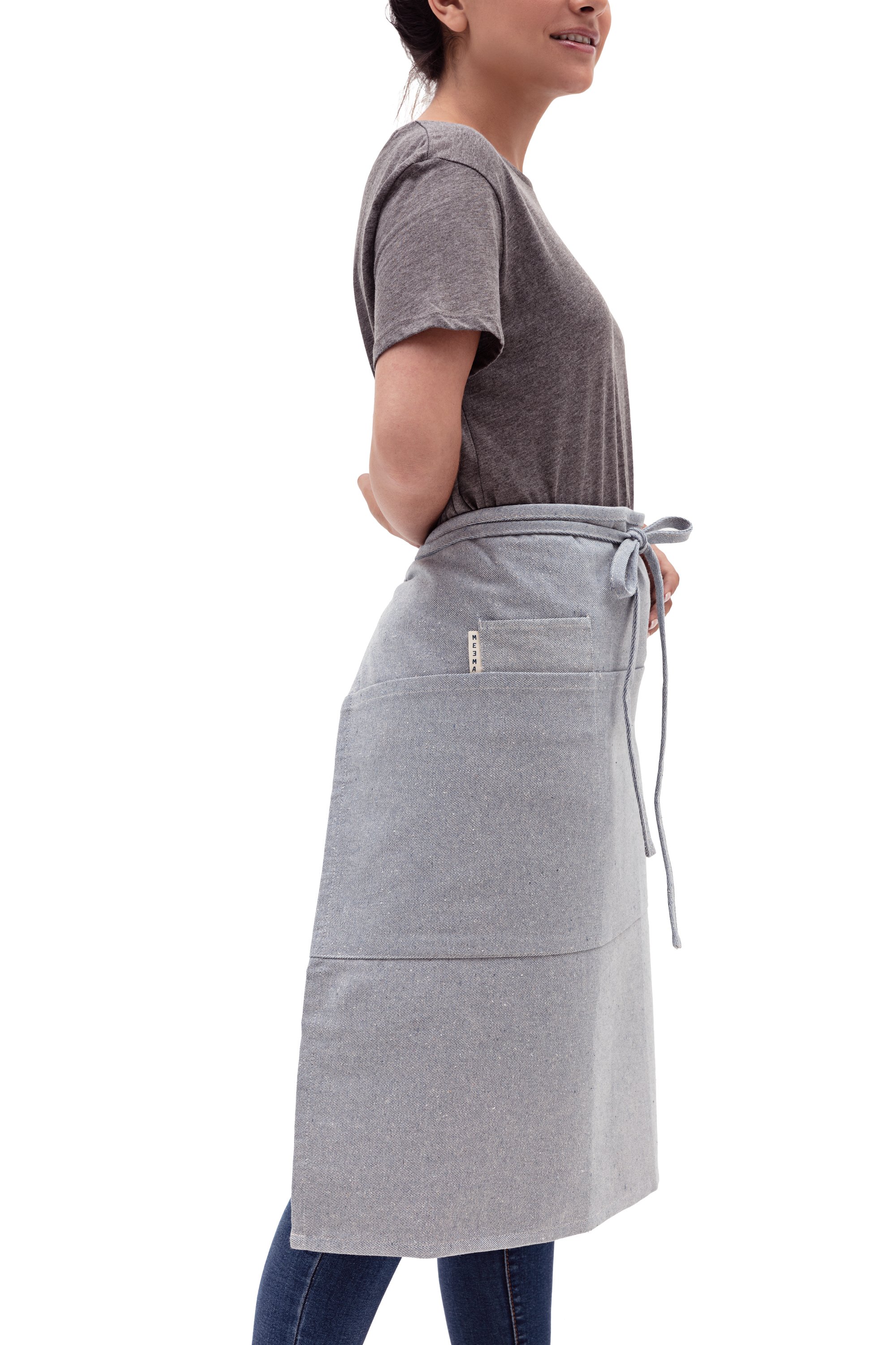 A stylish Bistro Apron featuring three large pockets, a small pocket, and a utility loop, made from 100% cotton with an eco-friendly design.