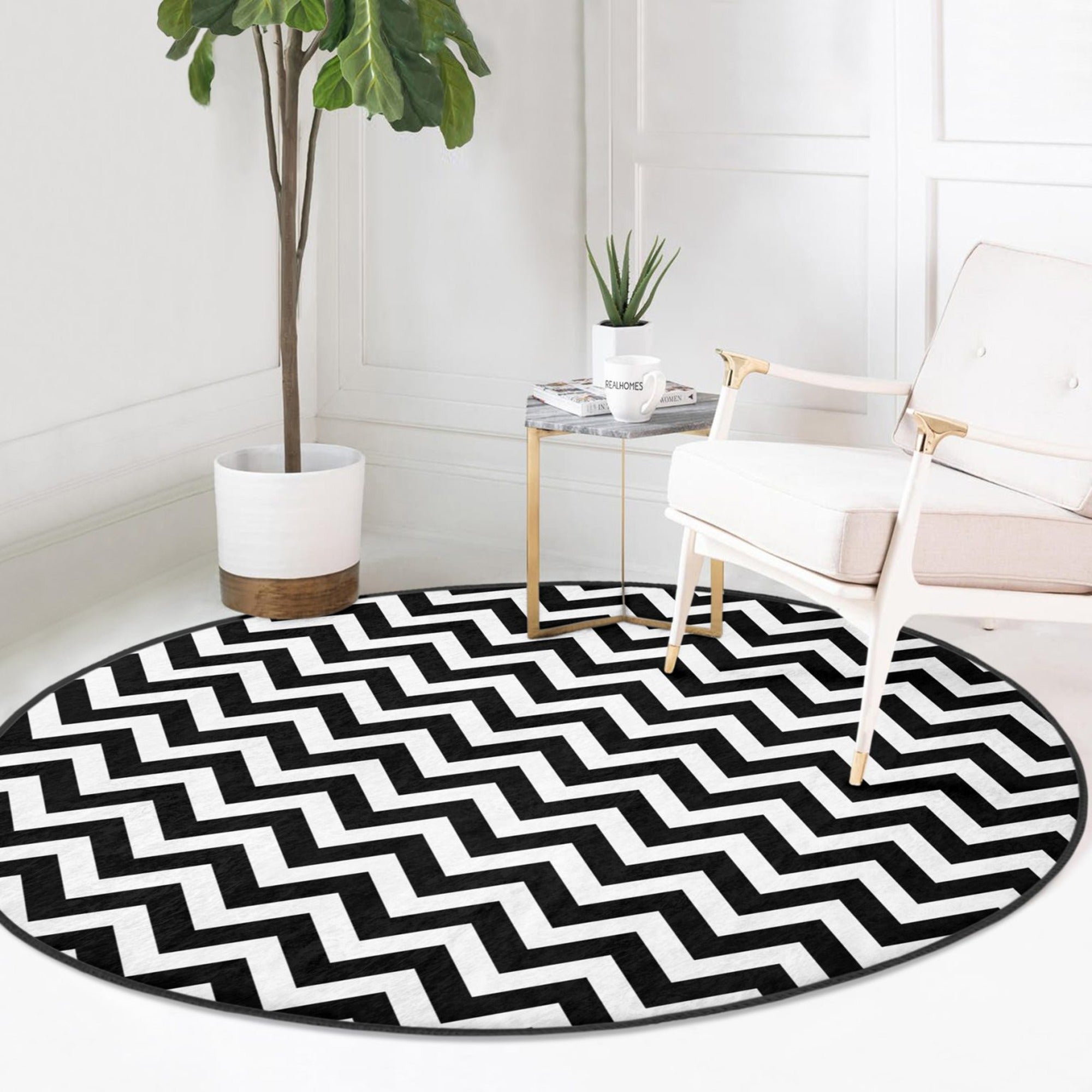 A stylish black and white round living room rug made of soft velvet fabric, showcasing a modern design suitable for various home decor styles.