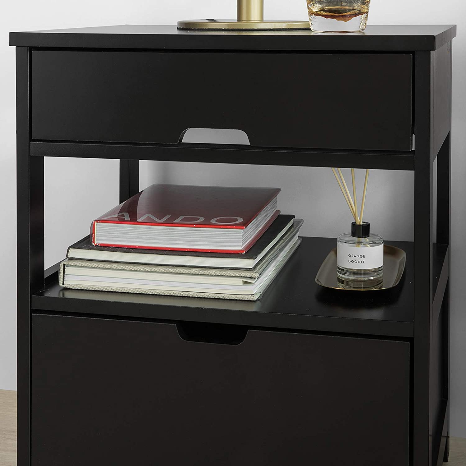 Black bedside table featuring two drawers and a shelf, designed for modern decor.