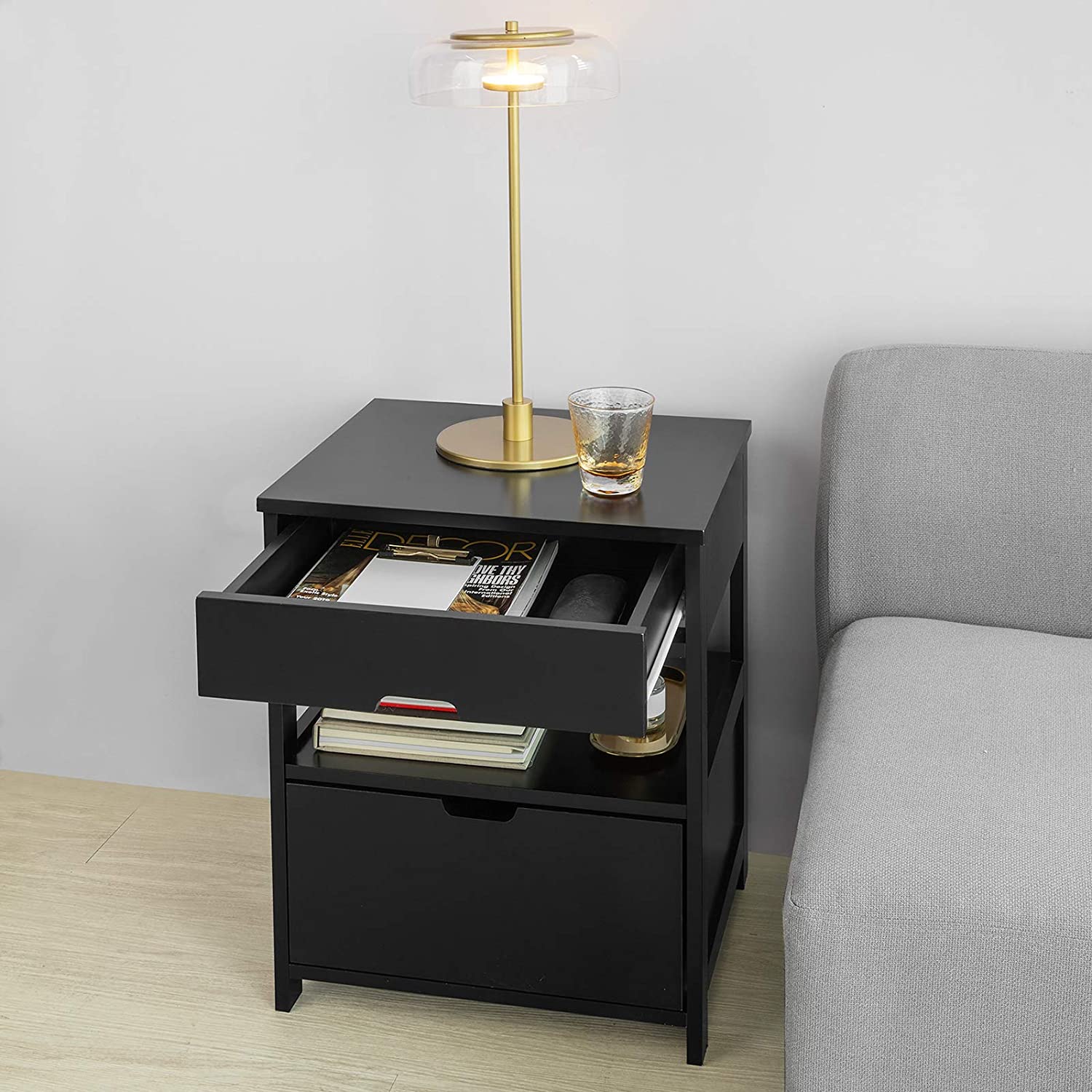 Black bedside table featuring two drawers and a shelf, designed for modern decor.