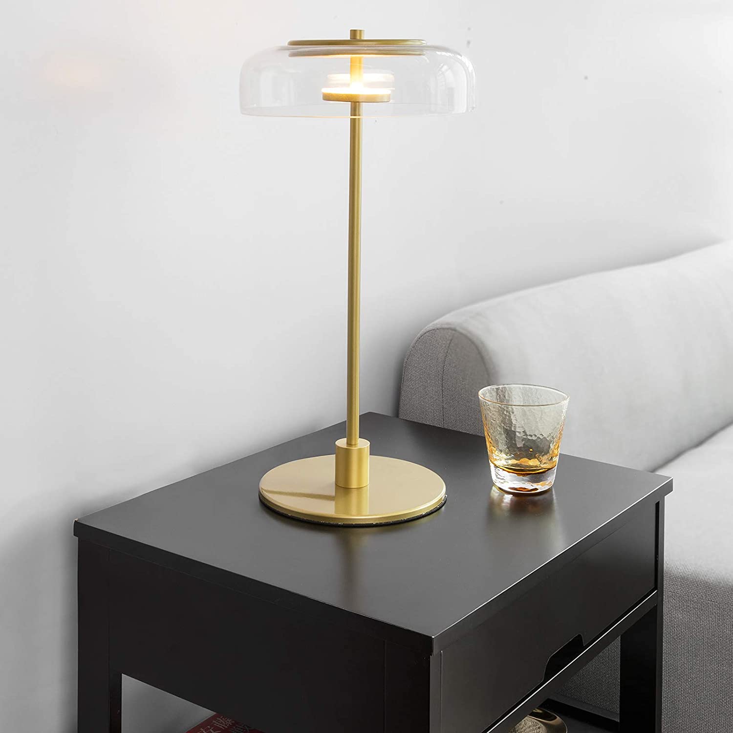 Black bedside table featuring two drawers and a shelf, designed for modern decor.