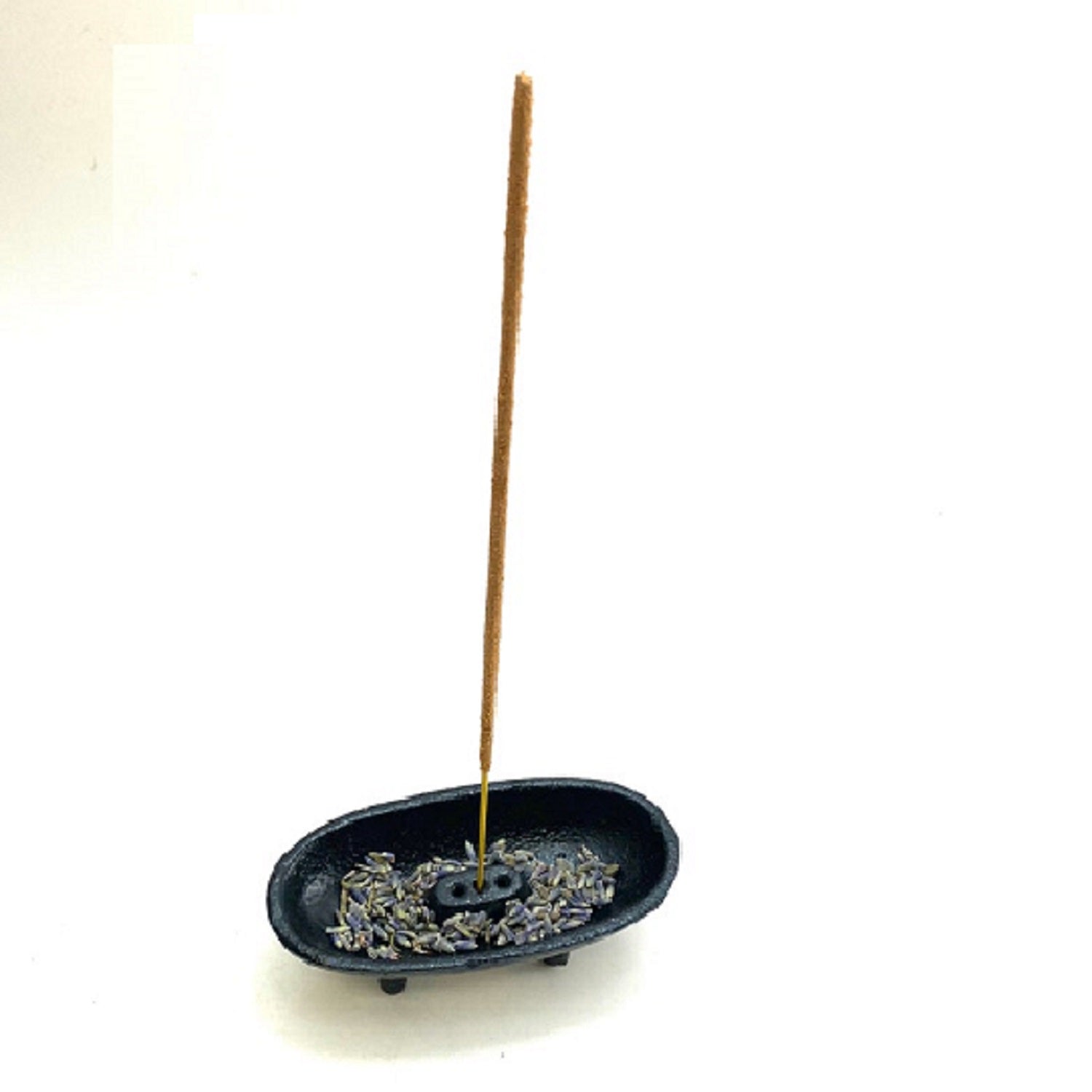 Black cast iron canoe-shaped incense smudge pot with removable holder for incense sticks and cones.