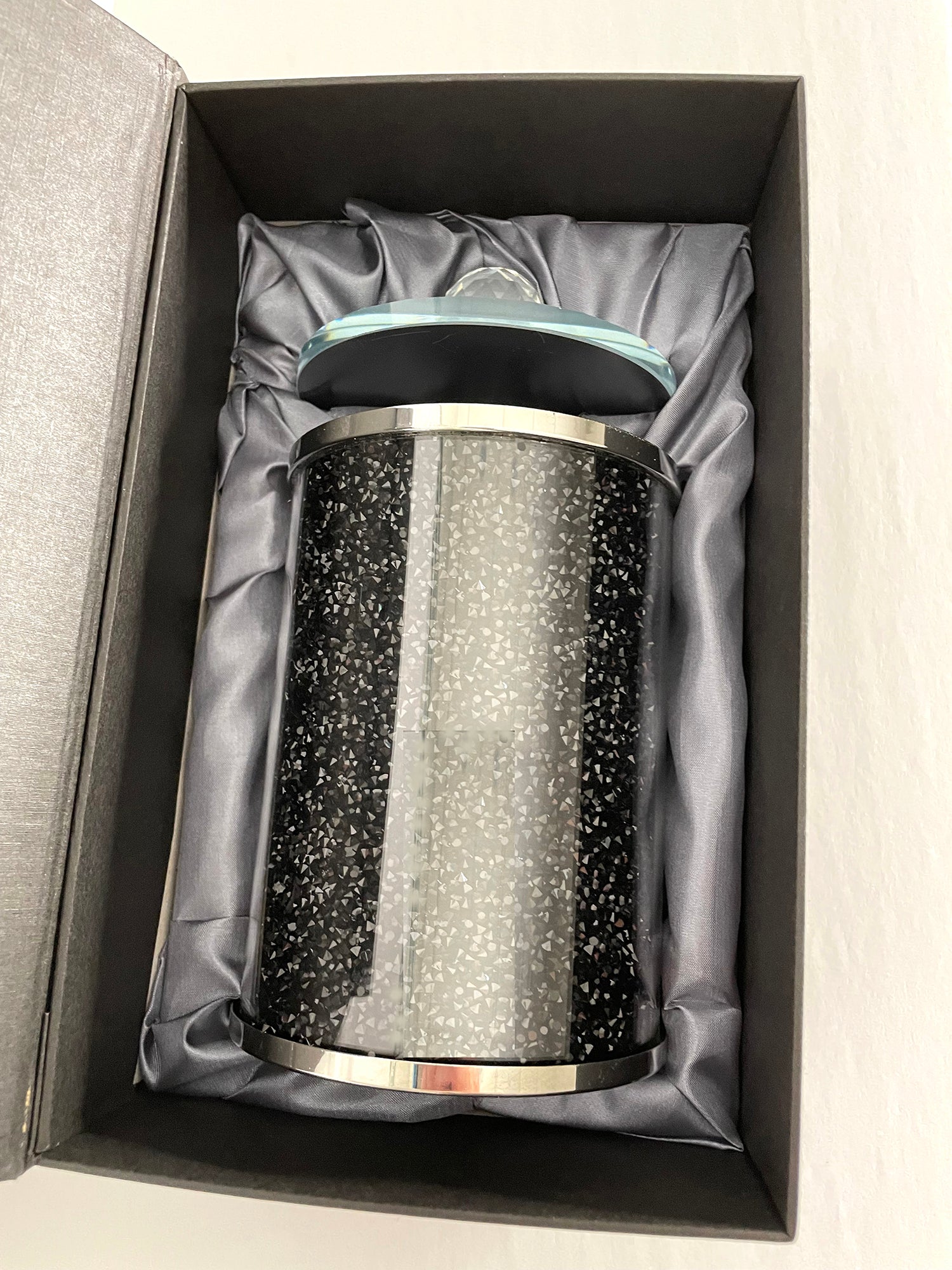 Elegant black crushed diamond glass canister with chrome base and glass lid, beautifully packaged in a gift box.