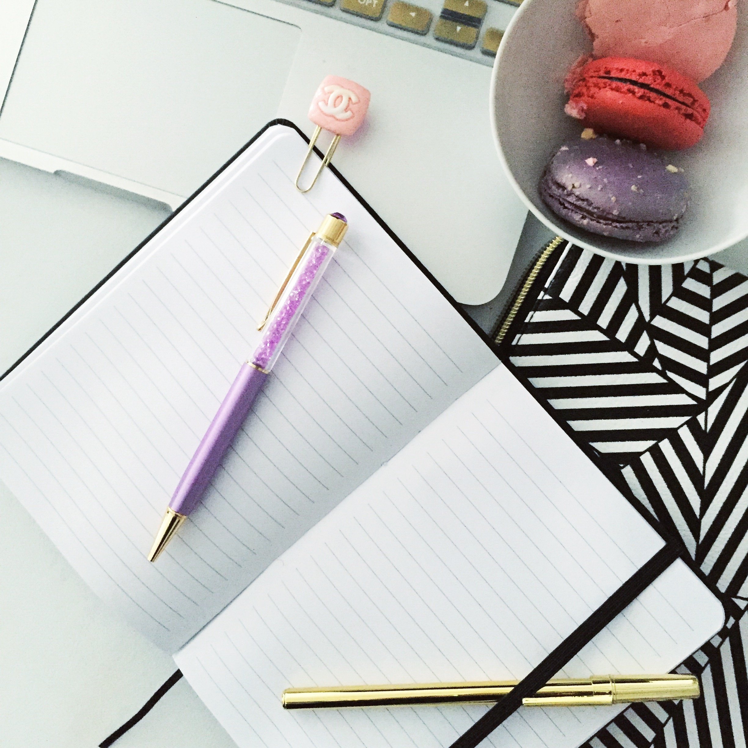 Black Girl Magic Notebook with soft PVC leather cover, gold writing, and elastic band closure, featuring 80 lined pages and a ribbon bookmark.