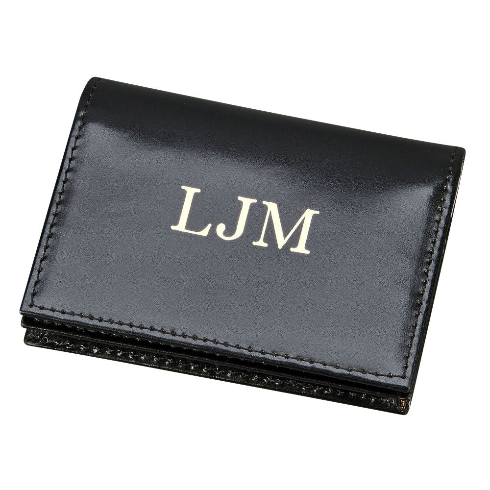 Black leather expanding card case with ID window and credit card slots, showcasing its elegant design and functionality.