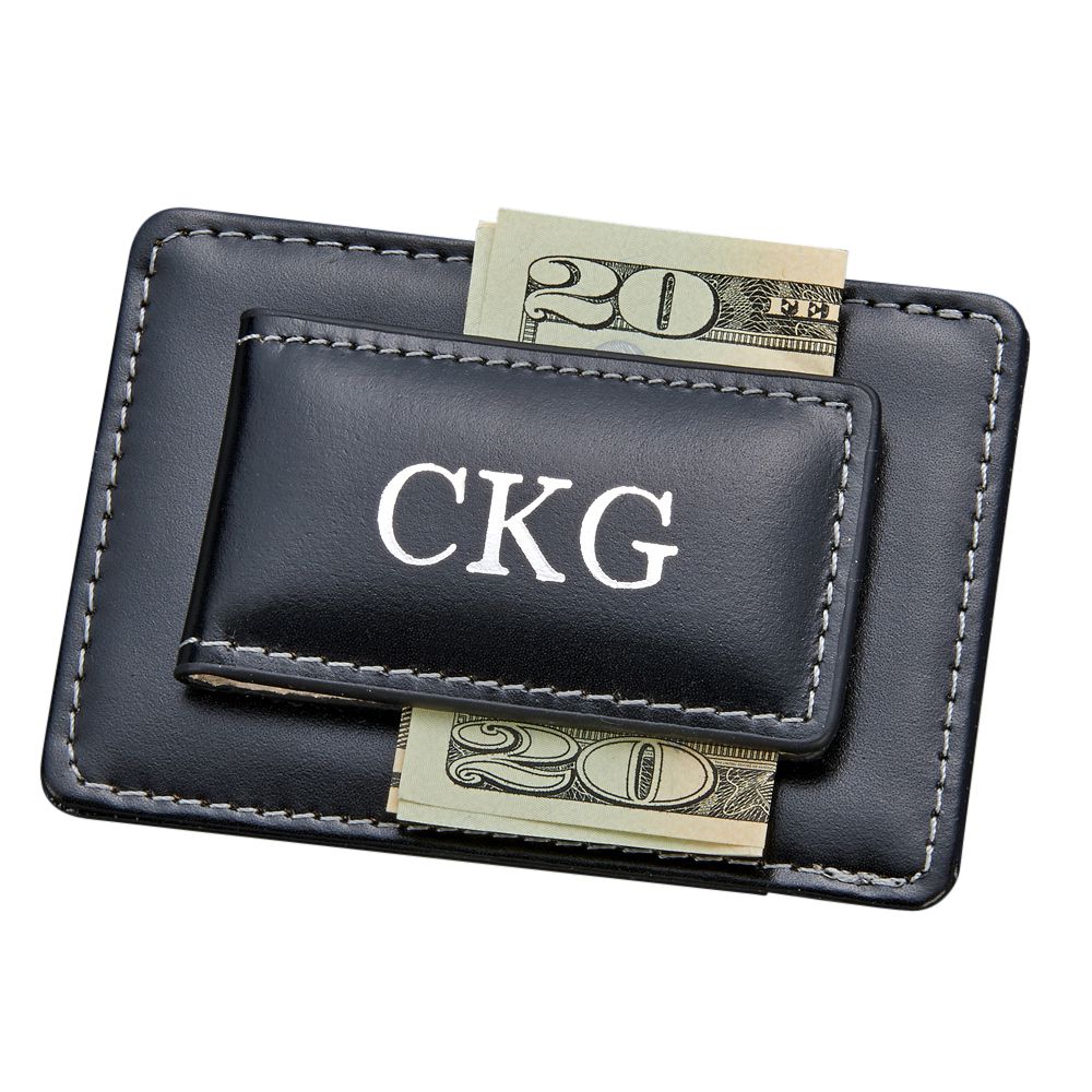 Black leather money clip and card holder with magnetic closure, featuring card slots and a sleek design.