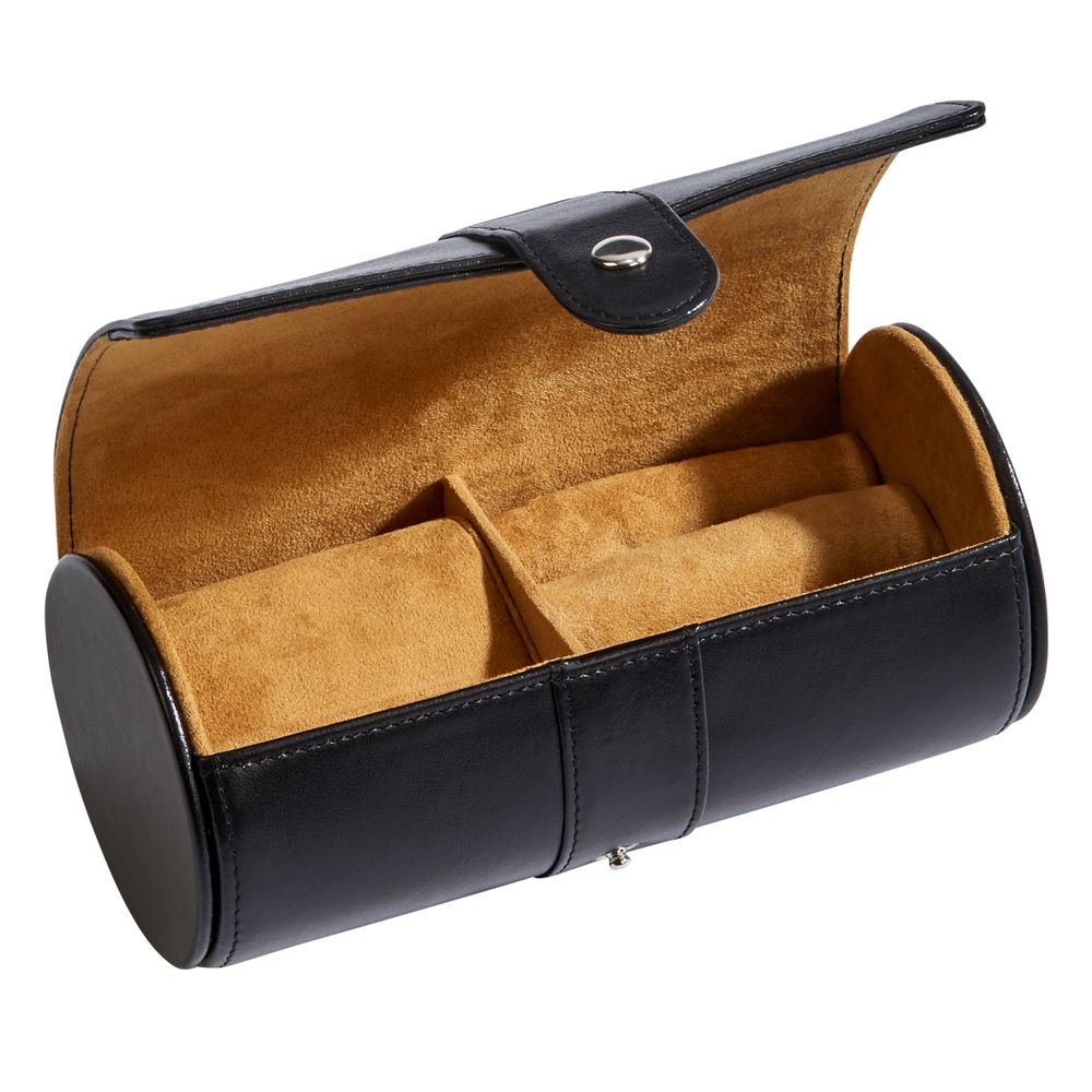 Black leather round jewelry case with a textured pillow insert and cushioned ring area, elegantly designed for travel and storage.