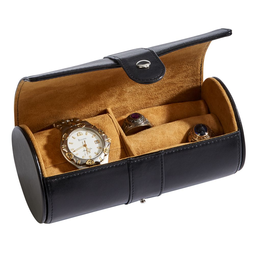 Black leather round jewelry case with a textured pillow insert and cushioned ring area, elegantly designed for travel and storage.