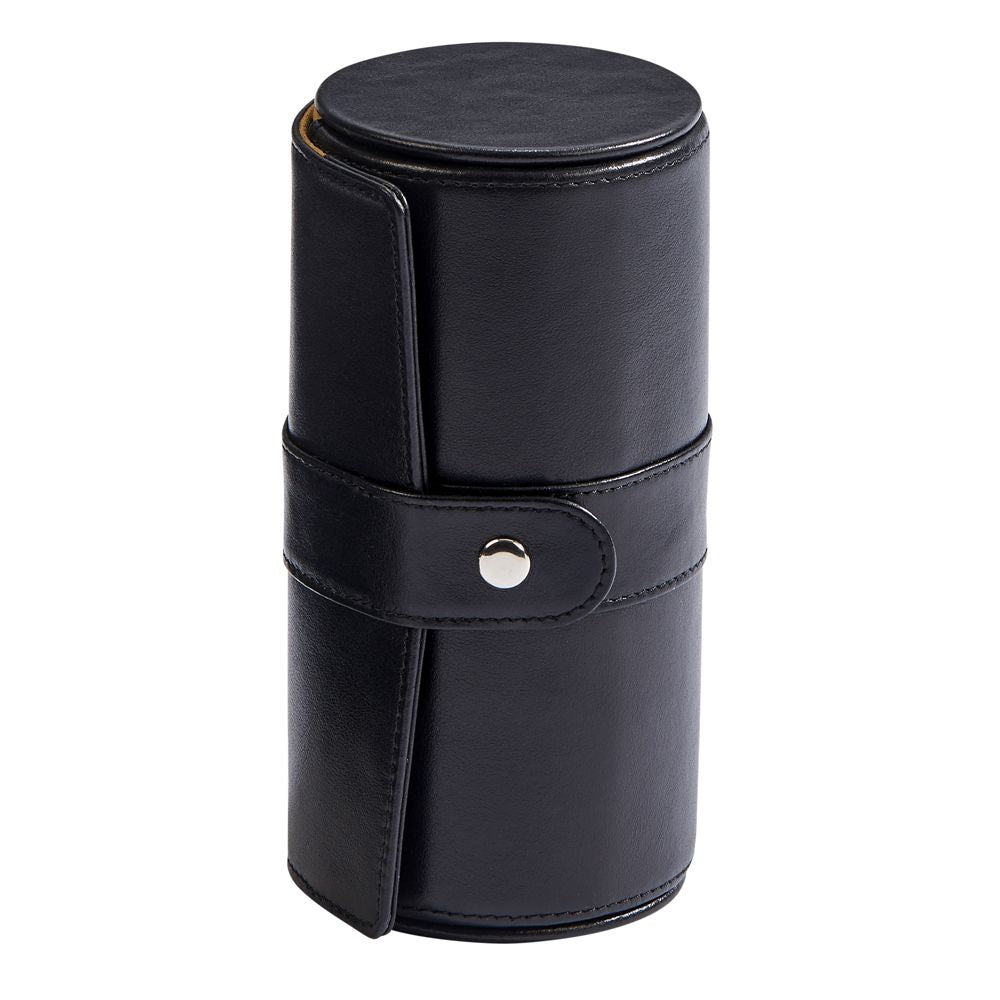 Black leather round jewelry case with a textured pillow insert and cushioned ring area, elegantly designed for travel and storage.