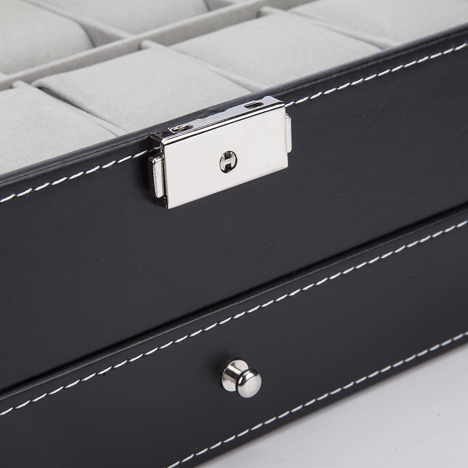 Elegant black leather watch box with glass lid, featuring 12 slots for watches and jewelry, showcasing a luxurious design.