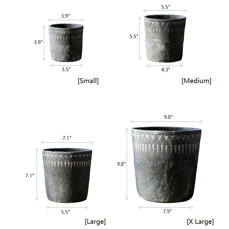 A stylish black pottery cement planter in various sizes, showcasing its modern design and durability.