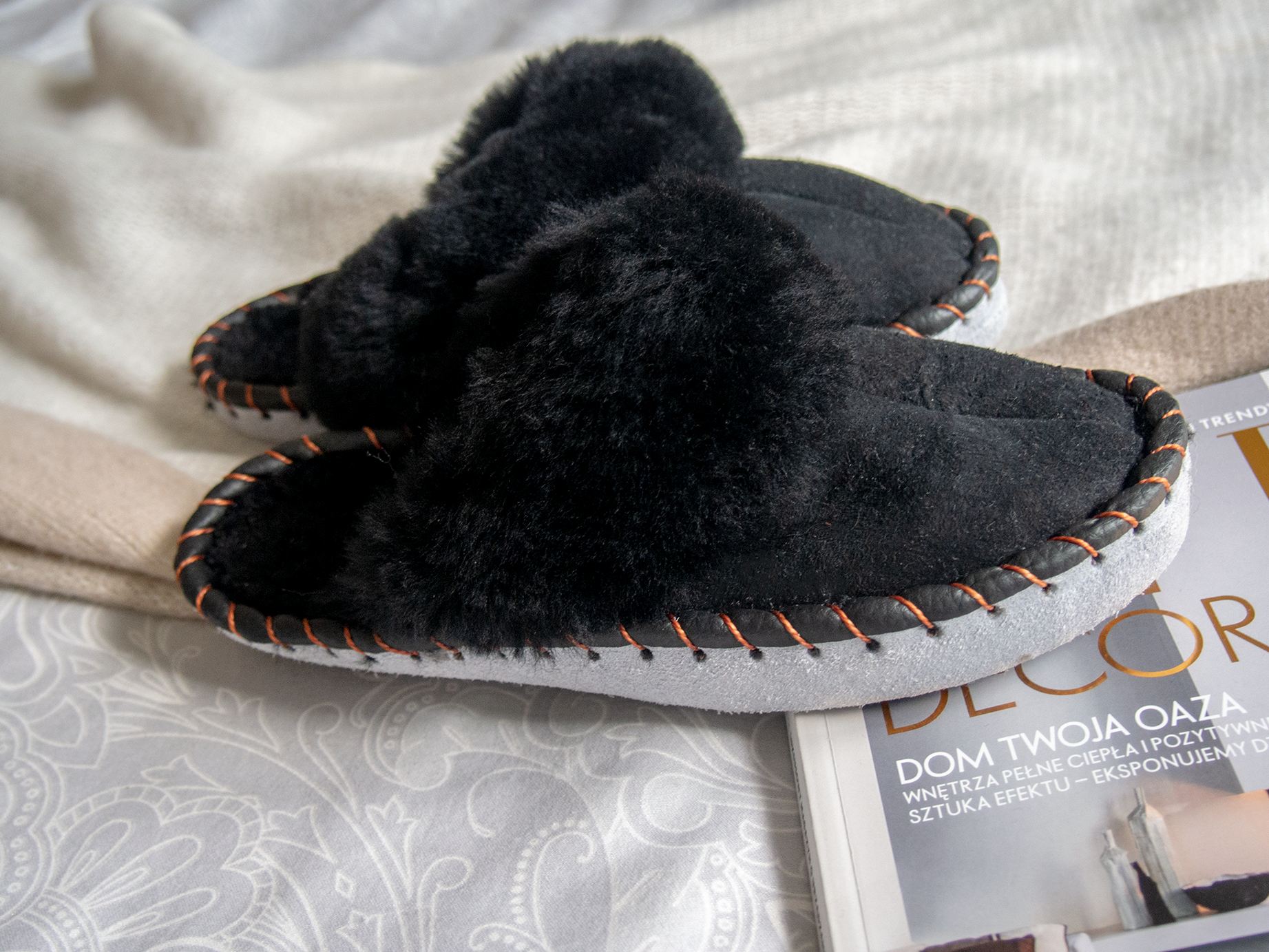 Elegant black shearling sheepskin mules, handcrafted with natural sheepskin and leather, showcasing a stylish and comfortable design.