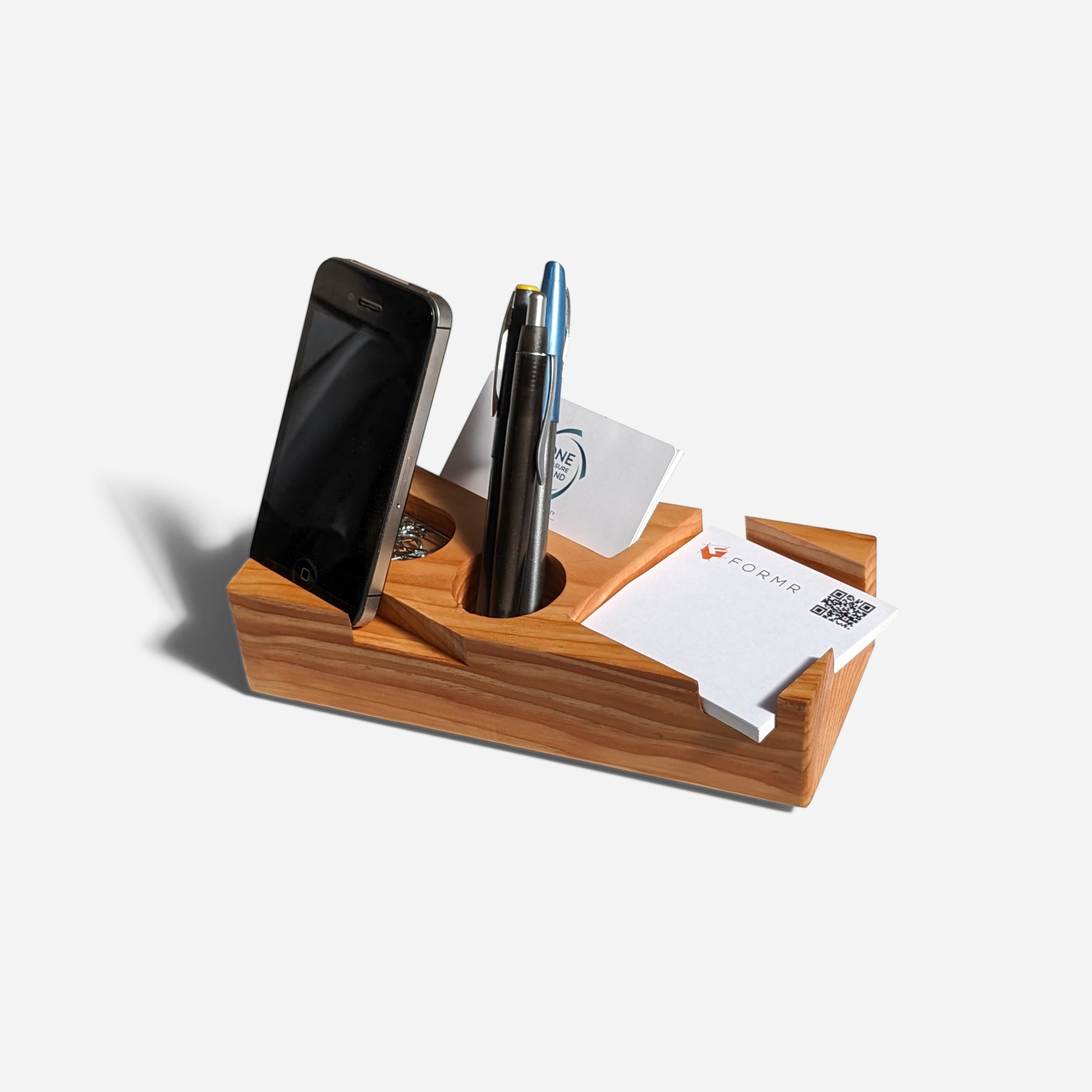 Blocky desk organizer in natural wood finish, showcasing its unique design and functionality for office supplies.