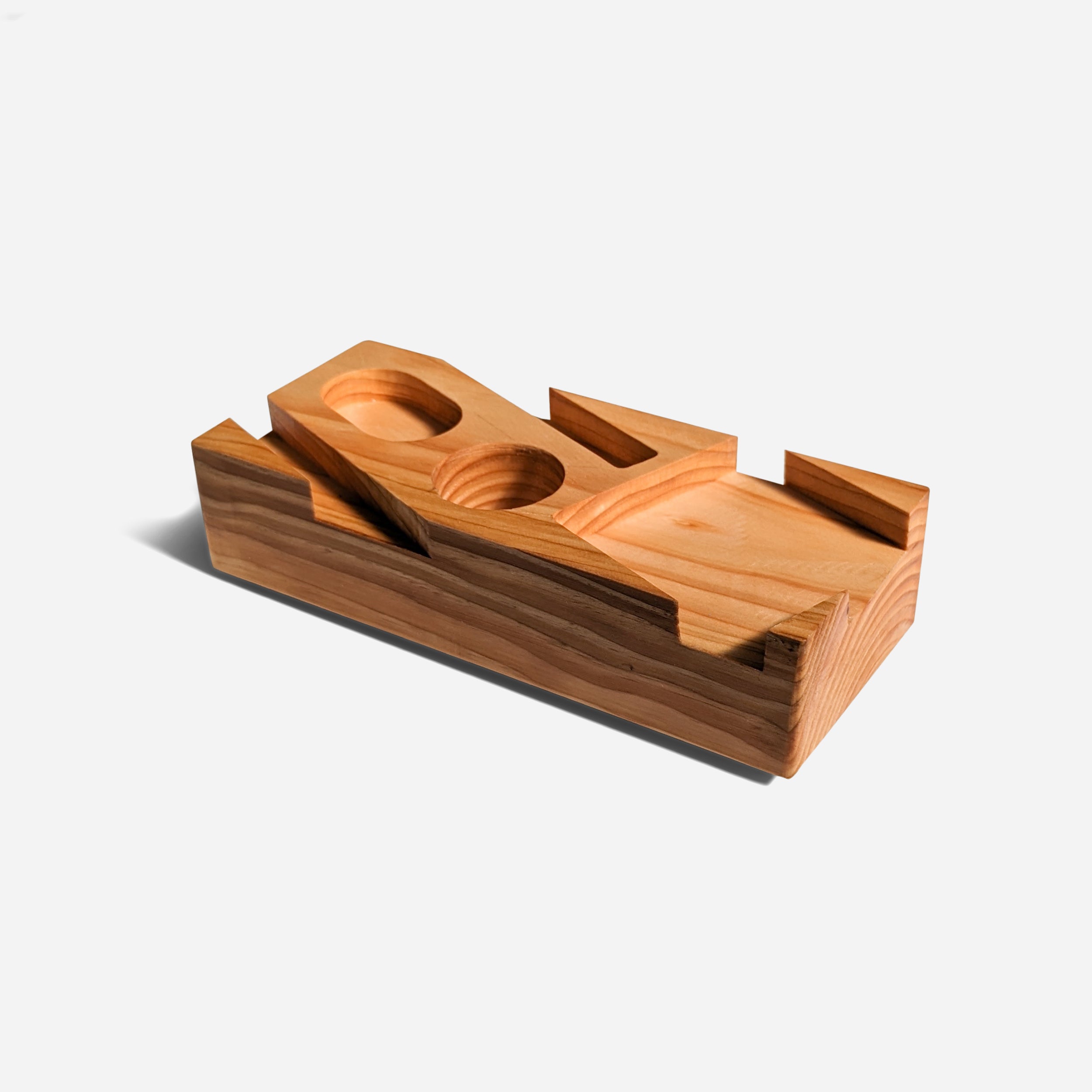 Blocky desk organizer in natural wood finish, showcasing its unique design and functionality for office supplies.