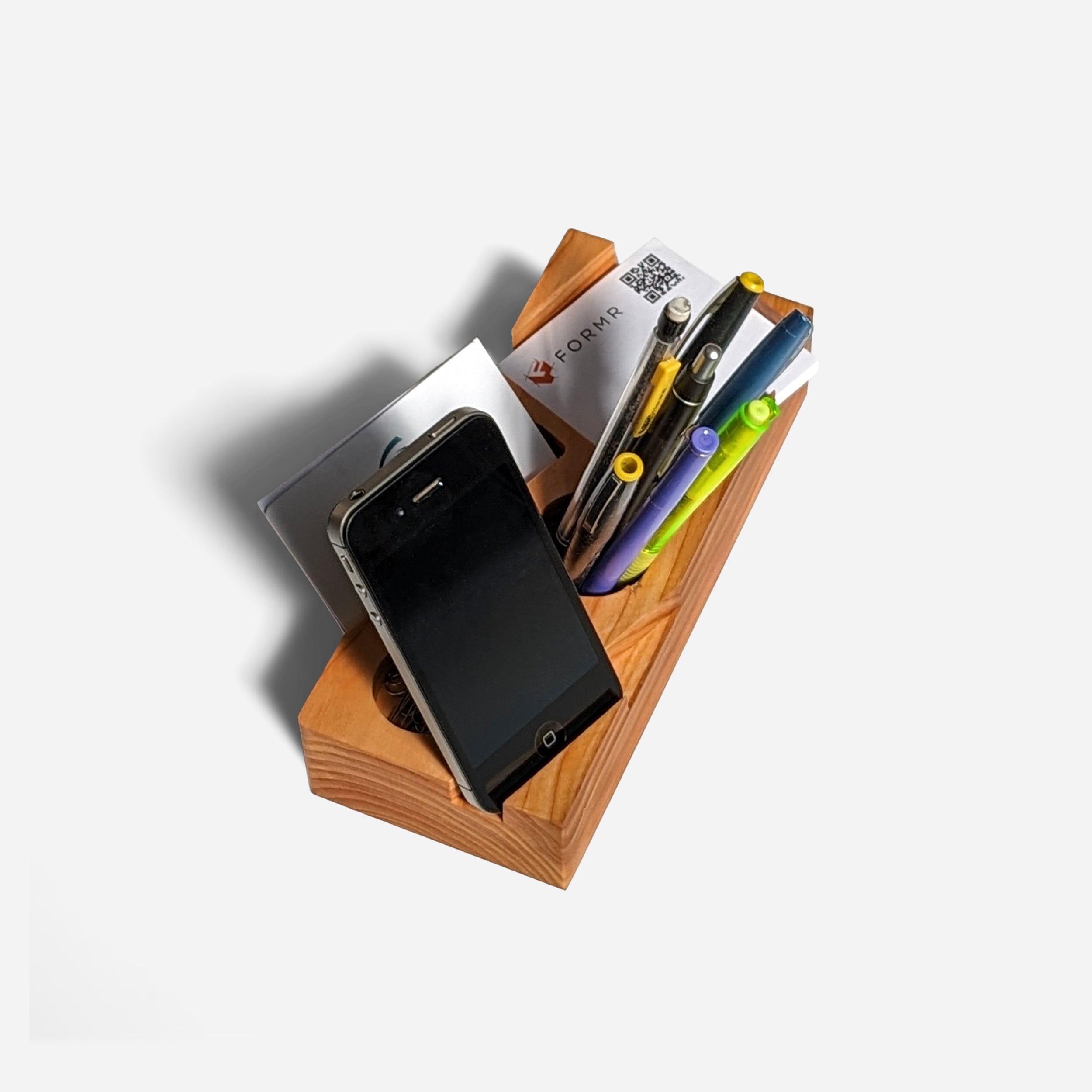 Blocky desk organizer in natural wood finish, showcasing its unique design and functionality for office supplies.