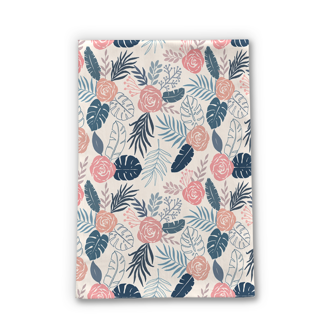 Blue and blush tropical floral tea towel made of cotton twill, featuring a vibrant floral design and hemmed edges, perfect for kitchen use.