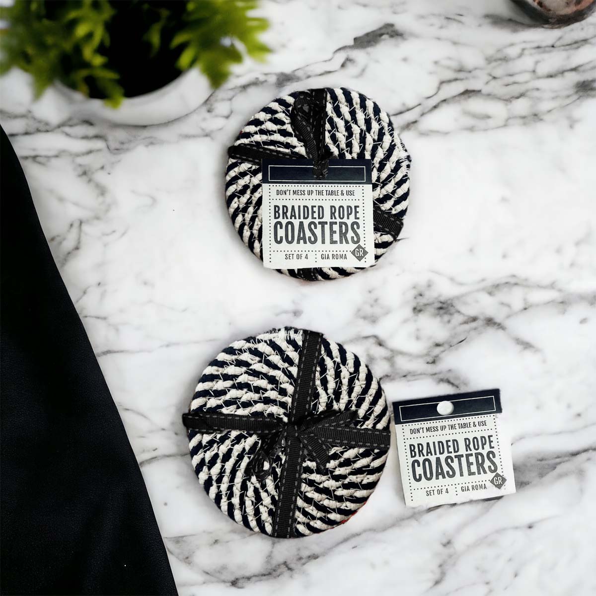 Set of four blue braided coasters with a candy cane stripe pattern, perfect for protecting surfaces and adding festive decor.