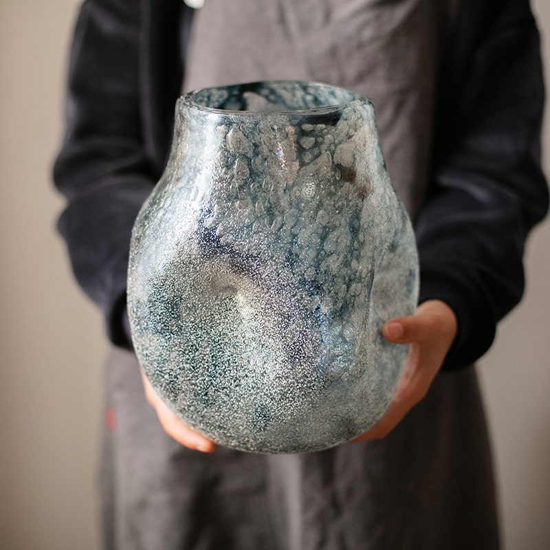 A beautifully handcrafted Blue Bubble Hand Blown Glass Vase showcasing unique bubble patterns and vibrant blue colors.