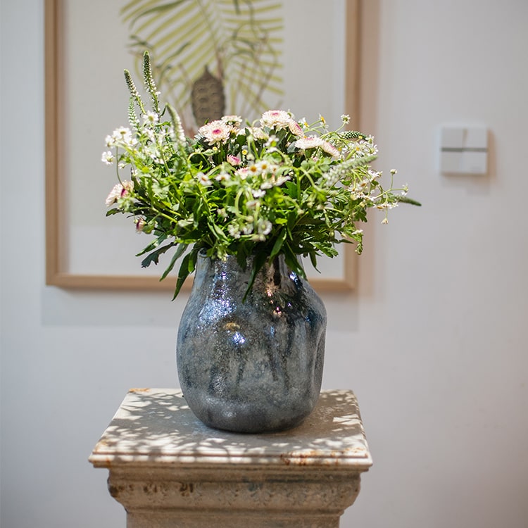 A beautifully handcrafted Blue Bubble Hand Blown Glass Vase showcasing unique bubble patterns and vibrant blue colors.