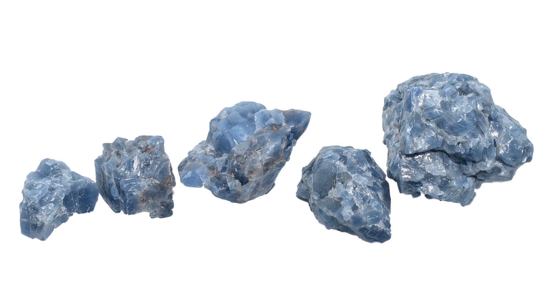 A collection of Blue Calcite Chunks in various sizes showcasing their soothing blue color and natural texture.