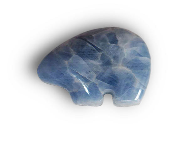 A hand-carved Blue Calcite Fetish Bear, showcasing its unique pale to medium deep blue color and Zuni style design, perfect for naturalists.